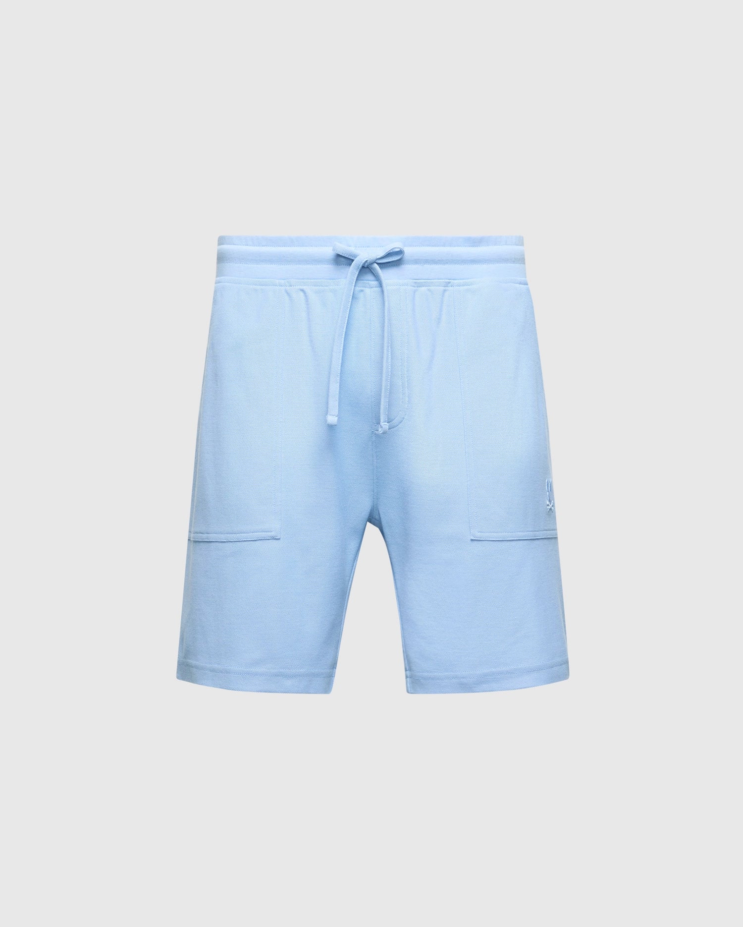The MENS TAYLOR LIGHT PIQUE SWEATSHORT by Psycho Bunny is a lightweight blue design with an elastic waistband, drawstring, and soft Pima cotton. It includes two front pockets and a subtle embroidered logo on the right side, making it ideal for a casual-chic wardrobe. Model: B6R344F200.