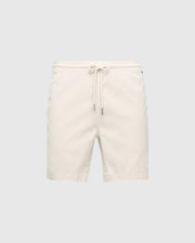 The MENS WILLIS STRETCH TENCEL SHORT in cream by Psycho Bunny features a Stretch Tencel™ blend with an elasticized waistband and drawstring closure, set against a plain gray background, perfect for effortless casual style.