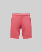 Psycho Bunny MENS SHIRO KNIT HONEYCOMB SHORT - B6R585F200 in coral pink, featuring belt loops, side pockets, zip fly, and single button closure, displayed on a plain light gray background.