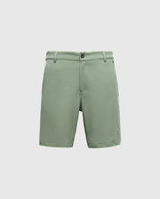Psycho Bunny's Mens Shiro Knit Honeycomb Short in light green features a button and zip closure, belt loops, and side pockets. Made from honeycomb piqué fabric, it is presented against a plain white background.