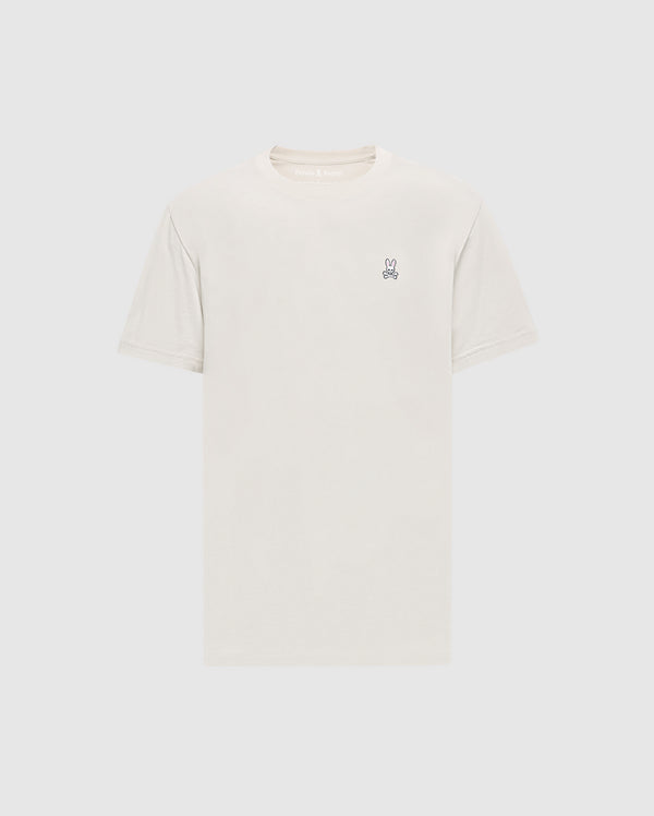 The Psycho Bunny Men's Classic Crew Neck Tee (B6U014B200) in light beige is a premium Pima cotton shirt with short sleeves and an embroidered bunny logo on the upper left chest. Set against a simple white background, it embodies timeless appeal.
