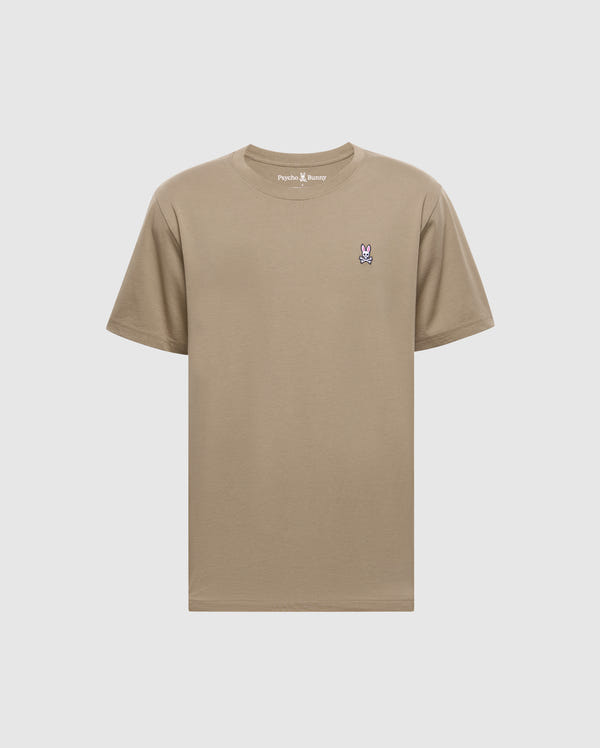 The Psycho Bunny Men's Classic Crew Neck Tee (B6U014CRPC) is a wardrobe essential made from 100% Pima cotton in beige, featuring a purple and white embroidered bunny logo on the left chest and a matching beige rib-knit trim for style.