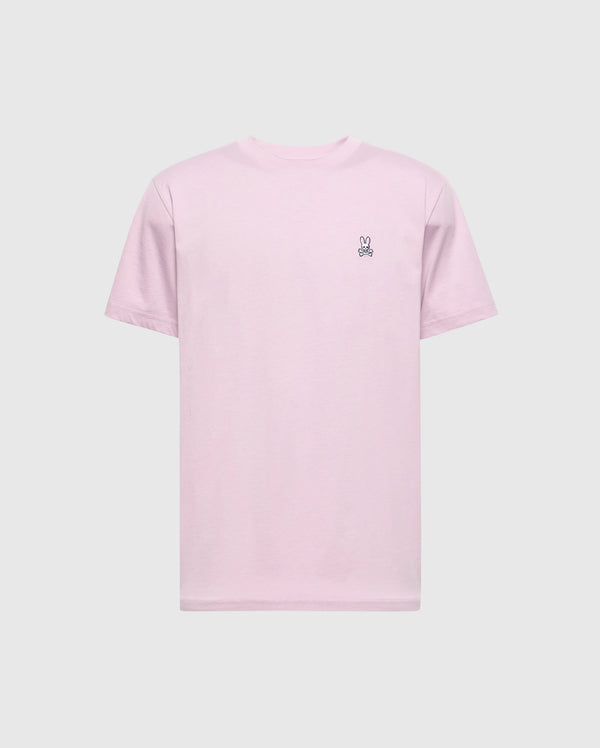 The Psycho Bunny Men's Classic Crew Neck Tee (B6U014F200) is light pink with short sleeves, made of soft pima cotton. It features an embroidered peace sign hand on the upper left side, offering a regular fit and displayed against a plain background.