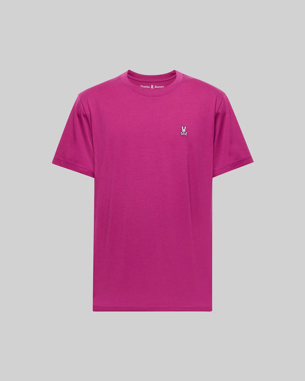 The Psycho Bunny MENS CLASSIC CREW NECK TEE (B6U014F200) is a premium magenta Pima cotton shirt with a white embroidered bunny logo on the left chest, shown against a light gray background.
