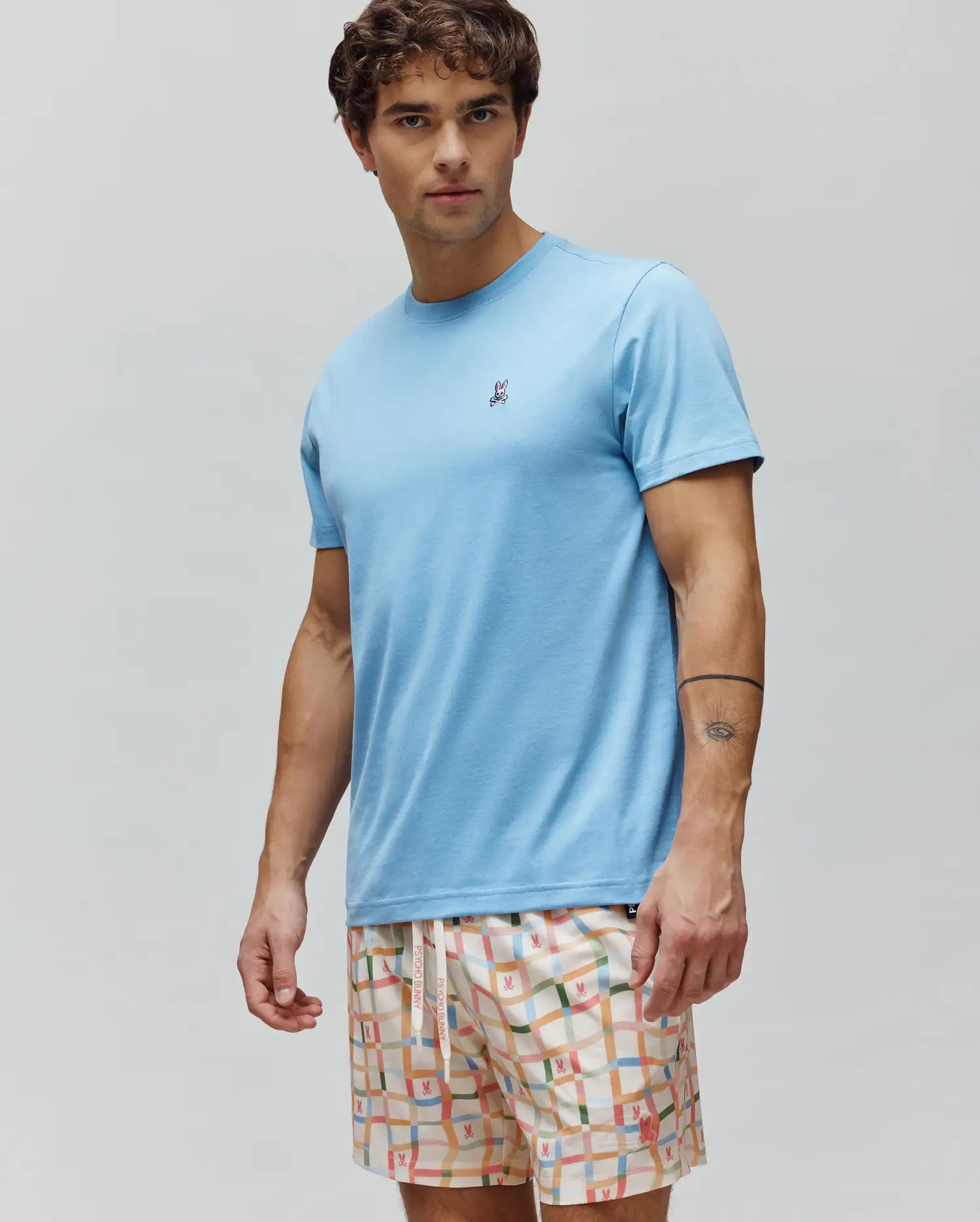 Mens Classic Crew Neck Tee in light blue, featuring a classic fit and smooth jersey fabric, with a small embroidered Psycho Bunny skull logo on the left chest.