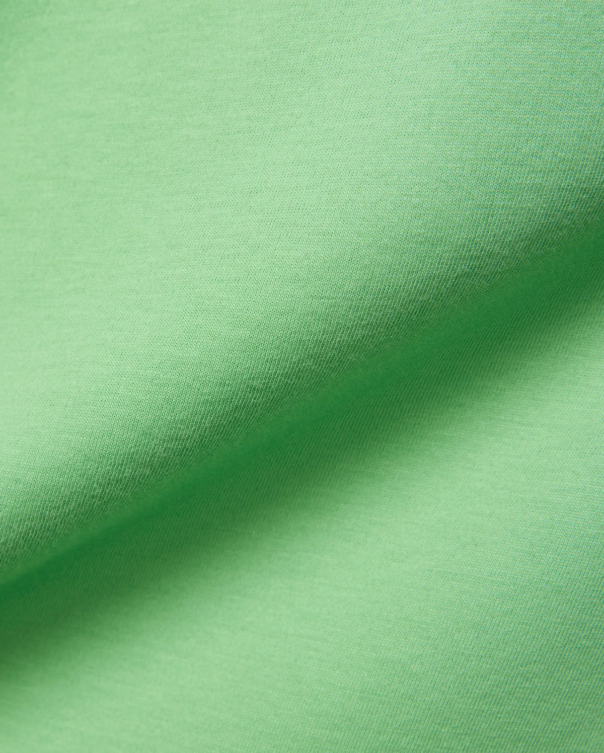 Psycho Bunny Mens Classic Crew Neck Tee in vibrant lime green, crafted from premium, ultra-soft jersey knit fabric, showcasing subtle texture and elegant folds. (6)