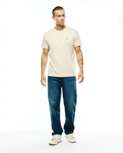 Mens Classic Crew Neck Tee in a light beige, smooth jersey knit with a classic fit, featuring a small, embroidered Psycho Bunny skull logo on the left chest. (4)