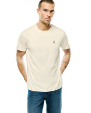 Mens Classic Crew Neck Tee in cream, featuring a small embroidered Psycho Bunny skull logo in pink, purple, black, and white on the left chest, with a classic fit and smooth jersey knit. (1)
