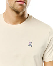 Cream Mens Classic Crew Neck Tee in smooth jersey knit, featuring a small embroidered Psycho Bunny skull logo with pink ears on the left chest for a classic fit. (2)