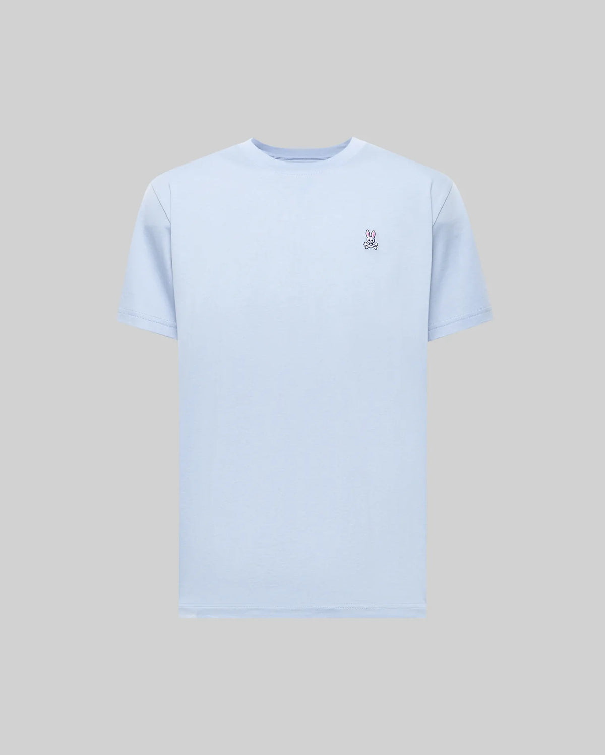 The Psycho Bunny MENS CLASSIC CREW NECK TEE - B6U014F200 is a light blue Pima cotton men's tee with a small embroidered peace sign on the left chest, shown on a gray background.
