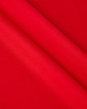 Close-up of the vibrant red Pima cotton fabric from the Psycho Bunny Men's Classic V-Neck Tee - B6U100CRPC, showcasing a smooth and even texture. Slight folds create gentle shadows, highlighting its sheen and refined appearance.