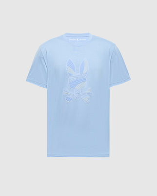 The Psycho Bunny MENS BAXTER GRAPHIC TEE (B6U409F200) is a light blue Pima cotton shirt with a stylized bunny skull and crossbones graphic on the front, shown against a plain white background.