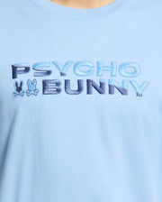The Psycho Bunny MENS BERNI EMBROIDERED WORDMARK GRAPHIC TEE - B6U417F200 is a light blue premium Pima cotton shirt, featuring "Psycho Bunny" in gradient blue letters with two bunny silhouettes and crossed bones beneath. It's exceptionally crafted and made in Peru.