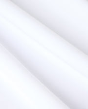 Close-up of heavyweight Pima cotton fabric on the MENS DUKE OVERSIZED TEE - B6U742D200 by Psycho Bunny, showcasing a smooth and clean surface. The solid pattern is evenly textured with subtle diagonal shadows, hinting at soft folds or gentle draping. The overall appearance is crisp, minimalistic, and bright.