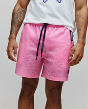 Mens Samos Hydrochromic Printed Swim Trunk, pink, with all-over hydrochromic bunny skull print, dark navy Psycho Bunny branded drawstring, small black embroidered bunny logo on left leg, and Psycho Bunny side tag. (7)
