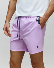 Mens Samos Hydrochromic Printed Swim Trunk in lavender, featuring dark teal drawstrings, a small embroidered Psycho Bunny logo on the left leg, and a larger Psycho Bunny keychain.