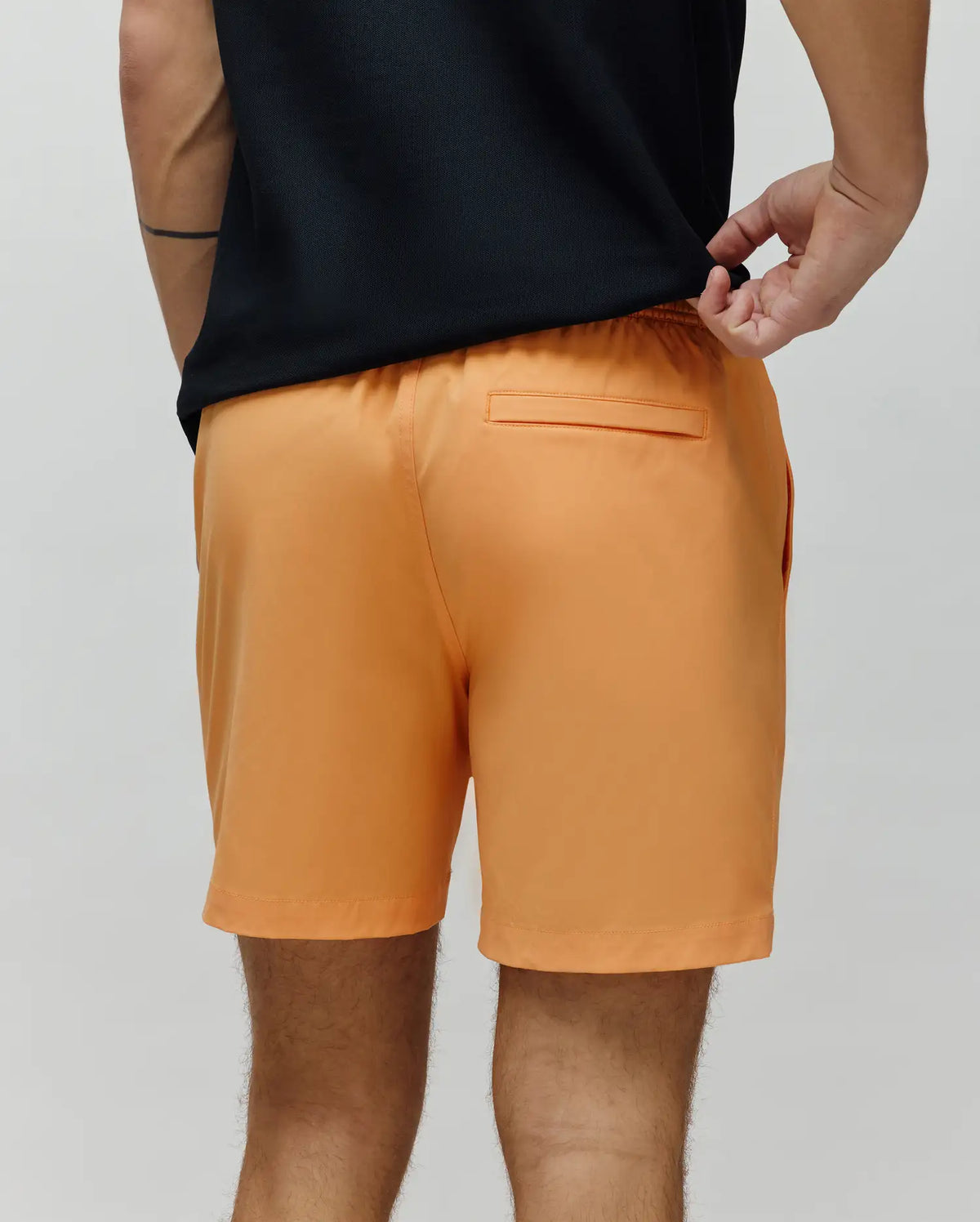 Mens Samos Hydrochromic Printed Swim Trunk in vibrant orange, featuring a relaxed fit, elastic waistband, smooth quick-dry fabric, and a subtle back welt pocket.