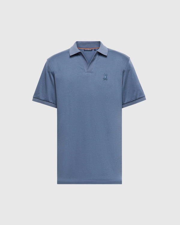The Psycho Bunny Men's Big and Tall Broadway Pima Interlock Johnny Collar Polo, B9K891D200, is a blue short-sleeved shirt made from luxurious Pima cotton. It features a collar, a subtle embroidered logo on the left chest, and a simple classic design with a mercerized finish for added luster.