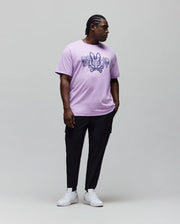 Mens Big And Tall Herman Graphic Tee in lavender jersey knit, featuring a bold, large dark blue Psycho Bunny skull and crossbones graphic logo with text on the chest, classic fit.