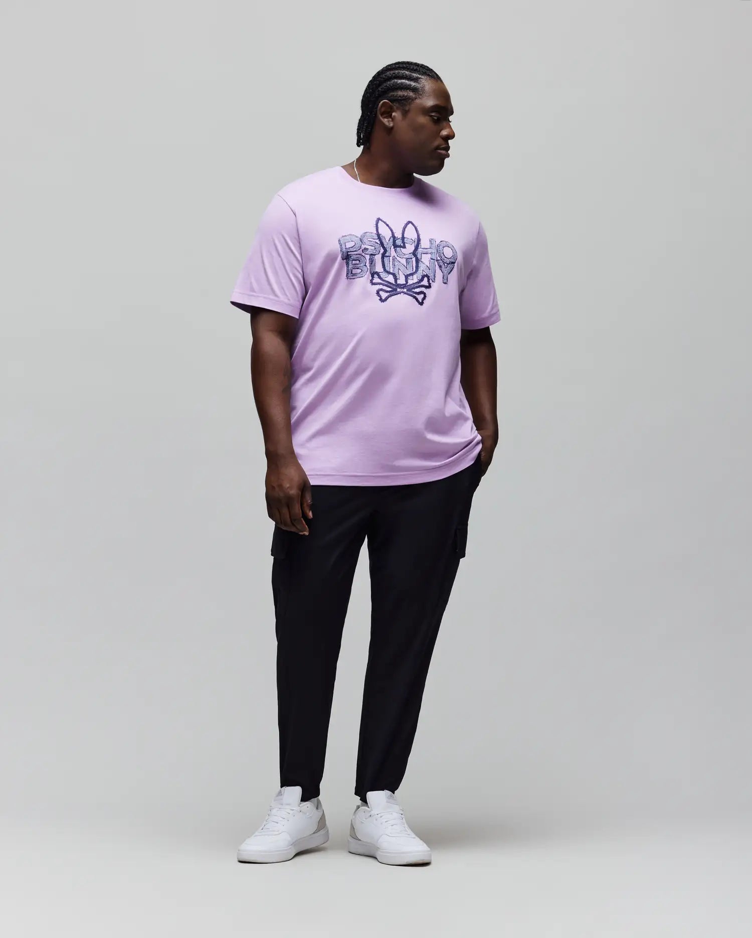 Mens Big And Tall Herman Graphic Tee in lavender jersey knit, featuring a bold, large dark blue Psycho Bunny skull and crossbones graphic logo with text on the chest, classic fit.