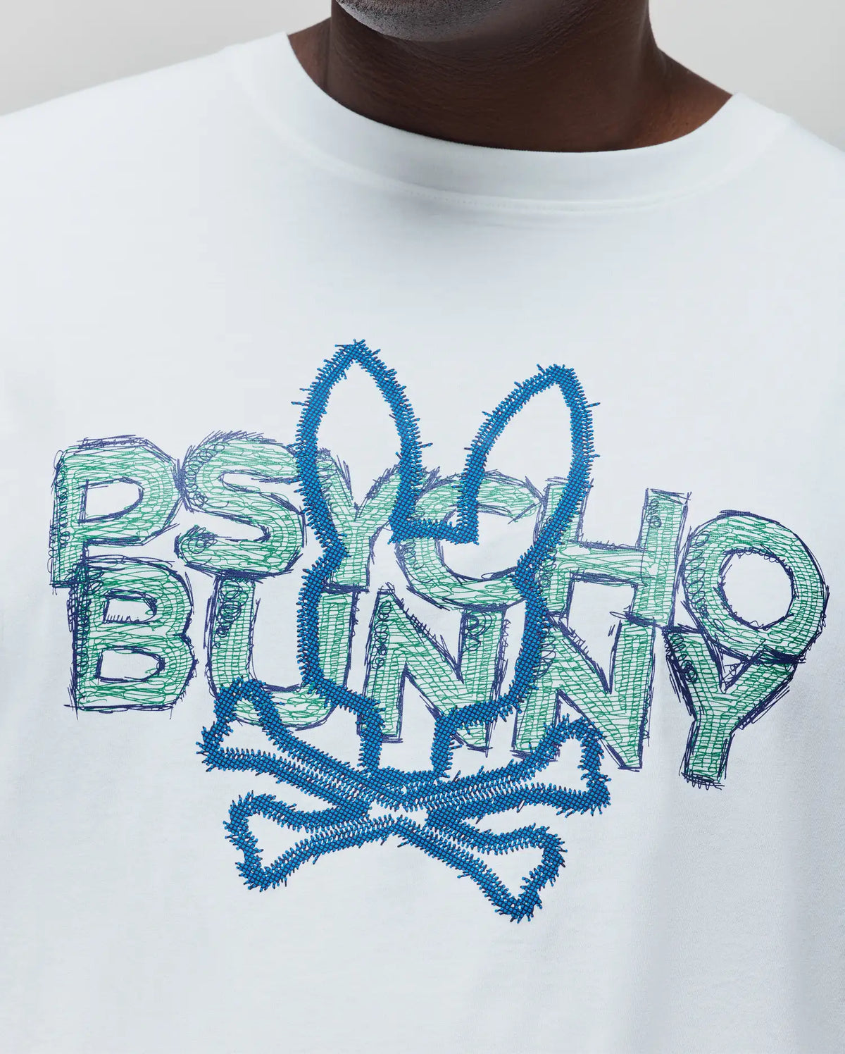 Mens Big And Tall Herman Graphic Tee, white smooth jersey with a large central distressed blue textured bunny skull and green scribbled Psycho Bunny text graphic.