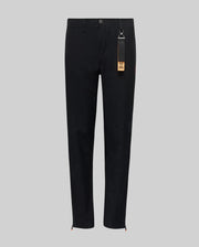 The Psycho Bunny KIDS MATHIEU COMMUTER PANT (KB0600002) features a black, straight-leg classic fit with a button and zip fly, elastic waistband, and a black tag with brown accent on the belt loop. Minimalist design shown on gray background.