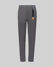 The Psycho Bunny KIDS MATHIEU COMMUTER PANT (KB0600002) is a slim-fit gray pair featuring button and zip closure, side pockets, and a black tag with gold label on the belt loop, shown against a light gray background.