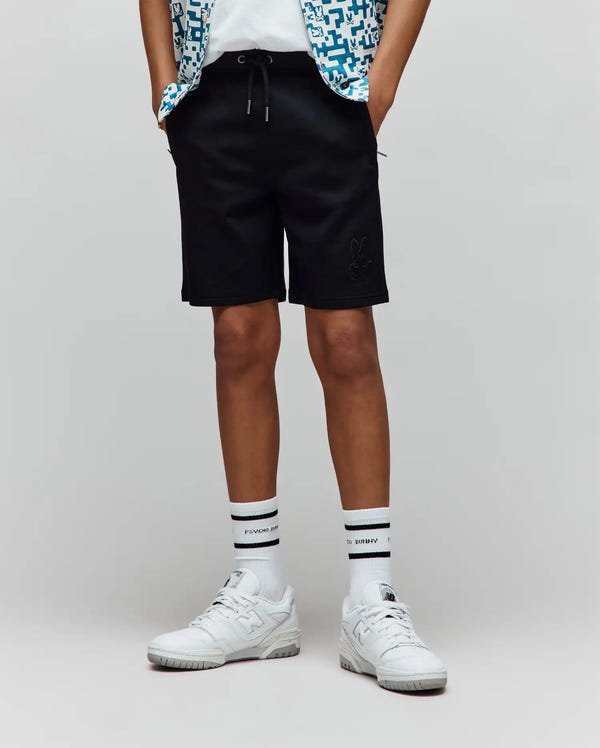 Kids Barry Modal Short, black, relaxed fit, smooth modal fabric, featuring a tonal embroidered Psycho Bunny skull logo on the left thigh and silver-tipped drawstrings.