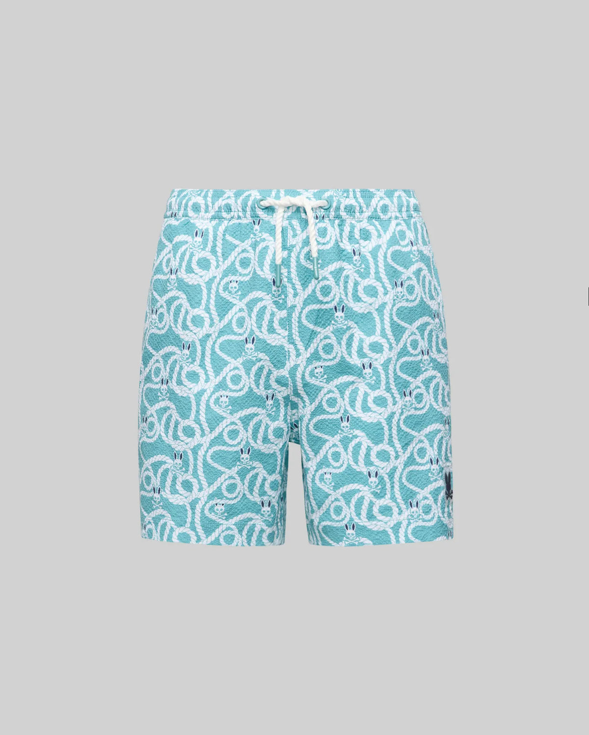 The Psycho Bunny KIDS CYRUS ALL OVER PRINT SWIM TRUNK (KB1000001) features aqua blue quick-drying seersucker, an allover rope graphic, elastic waistband with white drawstring, and a logo patch on the left leg, shown on a plain grey background.