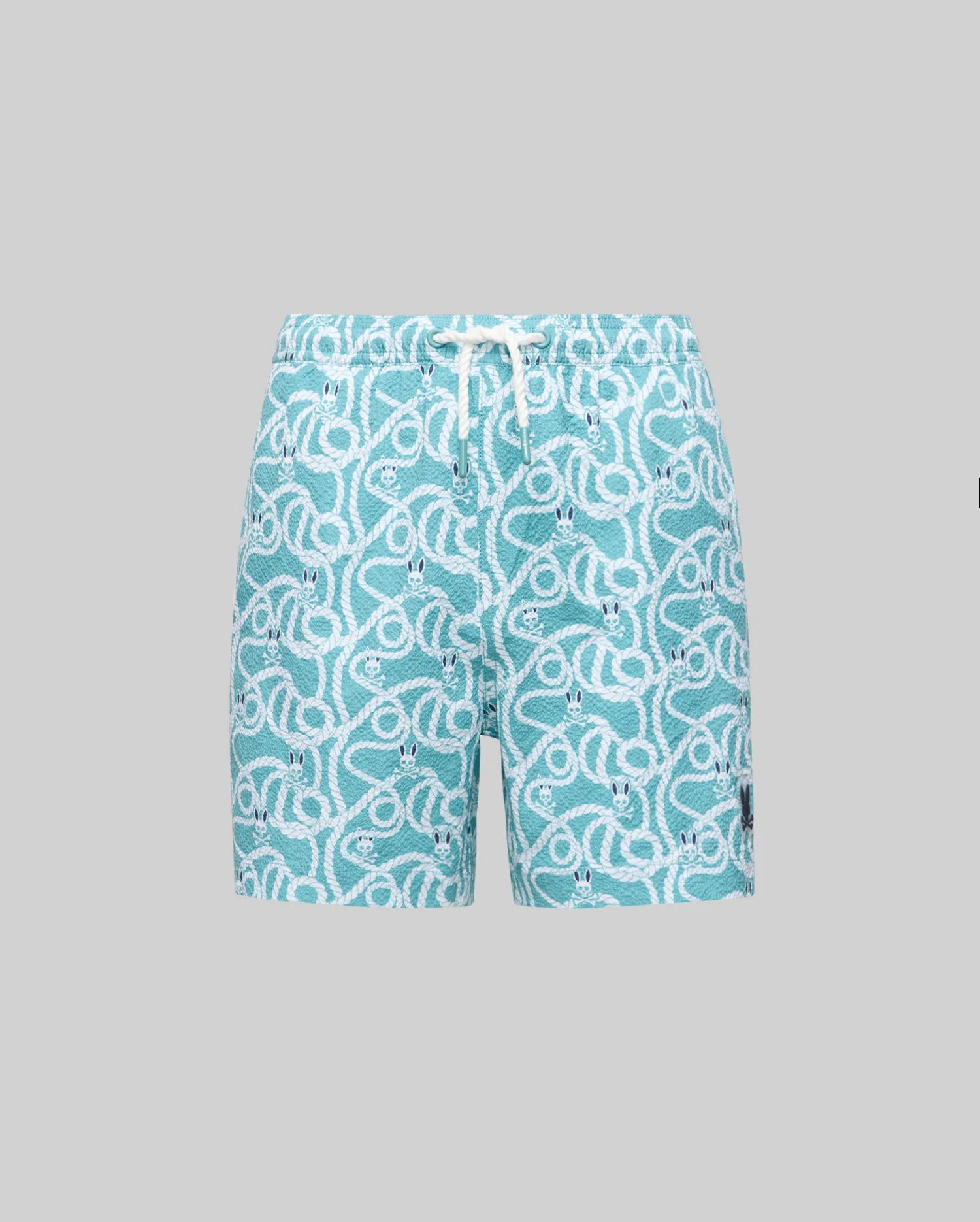 The Psycho Bunny KIDS CYRUS ALL OVER PRINT SWIM TRUNK (KB1000001) features aqua blue quick-drying seersucker, an allover rope graphic, elastic waistband with white drawstring, and a logo patch on the left leg, shown on a plain grey background.