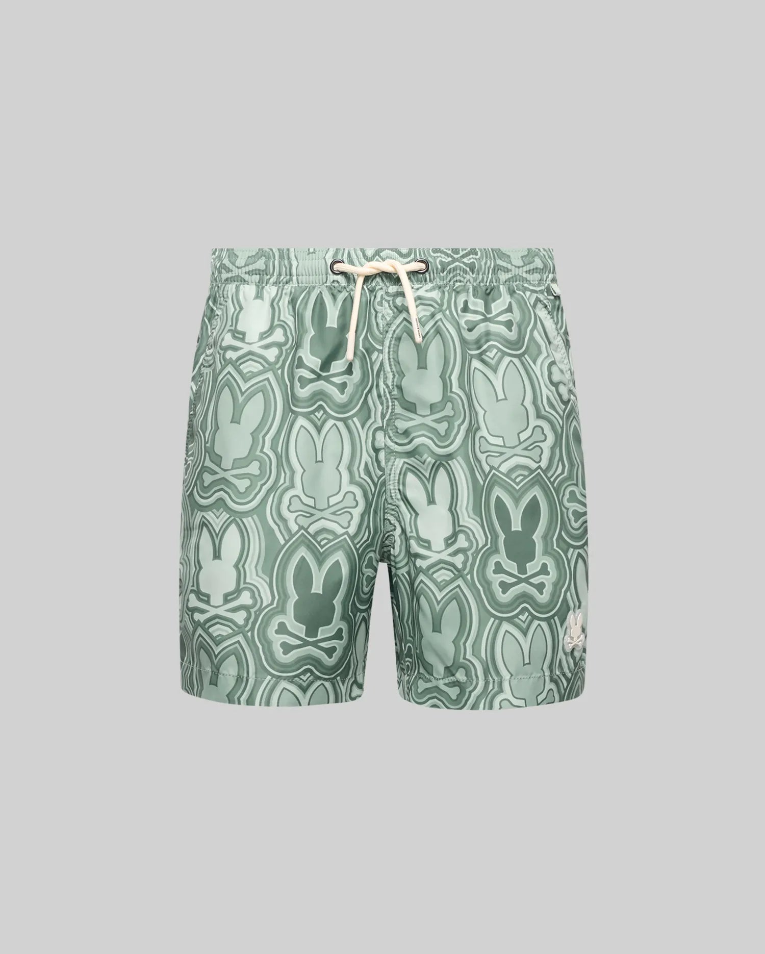 The Psycho Bunny KIDS CHUCK ALL OVER PRINT LIGHTWEIGHT SWIM TRUNK (KB1000002) features light green recycled polyester, a drawstring waist, and abstract bunny silhouettes in green shades, shown on a plain grey background.