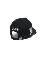 Black Kids Nathaniel A-Frame Trucker Cap with a large white embroidered Psycho Bunny skull logo on the side, three smaller white logos on the back, and a silver buckle featuring an engraved bunny skull. (4)