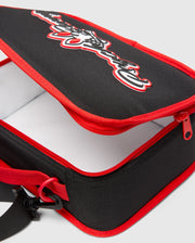 Black Kids Pal Lunch Box with red piping and zipper, featuring a large 3D white and red Psycho Bunny logo on the top, and an adjustable black strap. (2)