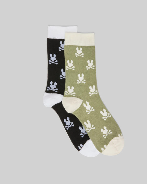 The Psycho Bunny KIDS 2 PACK ALL OVER BUNNY DRESS SOCK (KO2200003) includes two soft Pima cotton crew socks: one black with white accents and one olive green with cream, both featuring an allover Bunny pattern on gray.
