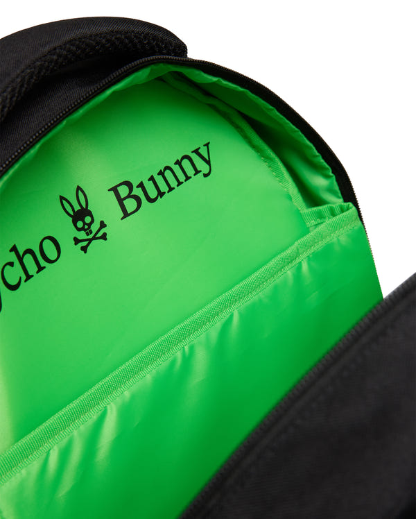 A close-up of the KIDS PSYCHO BUNNY BACKPACK - KO2400004 by Psycho Bunny reveals a bright green lining with a black bunny-with-crossbones logo. Made from durable canvas, it features padded straps for comfort and long-lasting use.