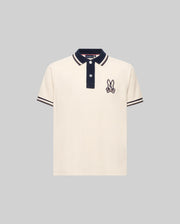 The Psycho Bunny KIDS WADE PIQUE POLO SHIRT (KT0100032) is a regular fit, cream Pima cotton polo with black colorblock tipping, black button placket, and embroidered bunny with crossed bones on the left chest.