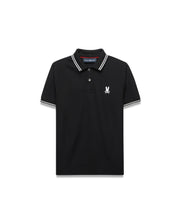 Kids Stan Pique Polo. Black classic fit pique polo with white double-striped collar and cuffs, red neck tape, and small white embroidered Psycho Bunny skull logo on left chest. (5)