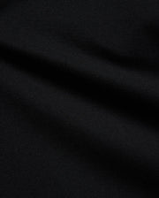 Psycho Bunny Kids Stan Pique Polo in deep black, showcasing the premium, breathable pique knit fabric with a subtle texture, perfect for refined streetwear. (6)