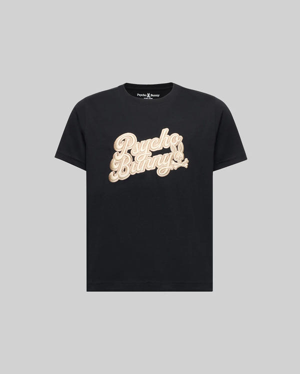 The KIDS ELIAS GRAPHIC TEE (KT0200013) by Psycho Bunny is a black Pima cotton short-sleeve shirt with "Psycho Bunny" in large beige script across the chest, shown on a plain gray background.