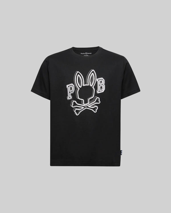The KIDS BALES GRAPHIC TEE - KT0200021 by Psycho Bunny is a black short-sleeve tee featuring a large Big Bunny skull and crossbones with "P B" on either side, shown on a plain gray background.