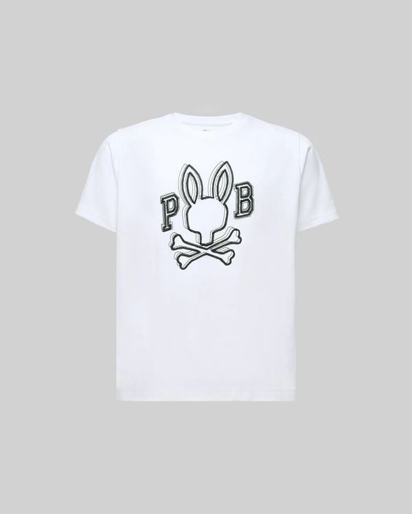 The KIDS BALES GRAPHIC TEE (KT0200021) by Psycho Bunny is a white Pima cotton shirt featuring a bold bunny head and crossbones print with "P" and "B" accents, set on a plain light gray background.