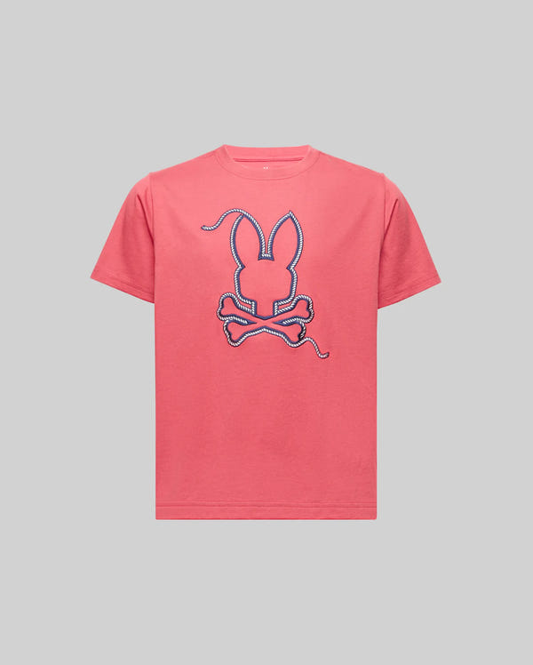 The KIDS CYRUS GRAPHIC TEE - KT0200047 by Psycho Bunny is a pink Pima cotton tee with a large bunny head and crossbones in a rope-like outline, evoking a sailor's spirit, shown against a plain gray background.