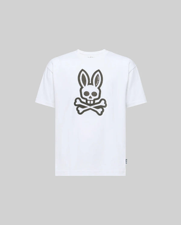 The Psycho Bunny KIDS RYDER OVERSIZED TEE (KT0200056) is a white premium Pima cotton tee, featuring an oversized graphic of a skull with bunny ears above crossed bones on the front, shown on a light grey background.