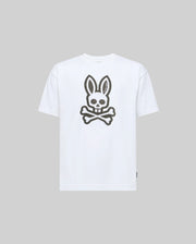 The Psycho Bunny KIDS RYDER OVERSIZED TEE (KT0200056) is a white premium Pima cotton tee, featuring an oversized graphic of a skull with bunny ears above crossed bones on the front, shown on a light grey background.