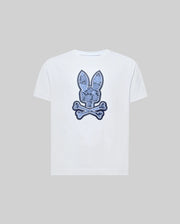 The Psycho Bunny KIDS ROWEN BUNNY GRAPHIC TEE (KT0200058) is a white Pima cotton tee featuring a blue bunny head over crossed bones, giving a playful skull-and-crossbones look against a plain gray background.
