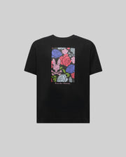 The KIDS ROWEN OVERSIZED TEE (KT0200093) by Psycho Bunny is a black relaxed fit shirt with a colorful floral graphic featuring a pink bunny and skull motif, plus "Psycho Bunny" printed below for an eye-catching look.