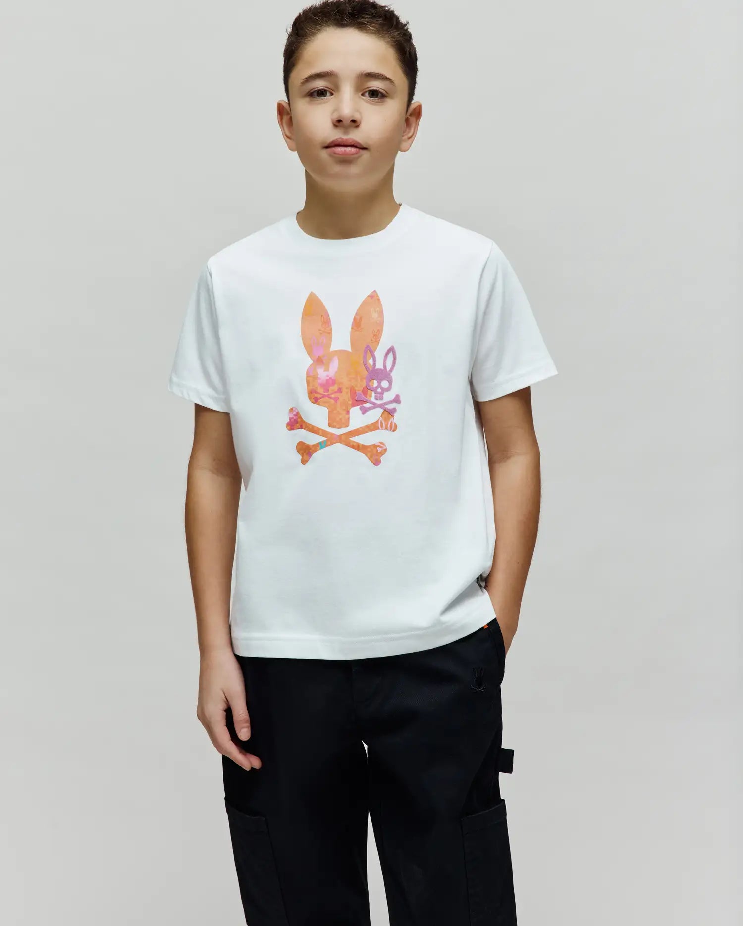Kids Van Graphic Tee, white classic fit jersey t-shirt with a large, patterned orange, pink, and purple Psycho Bunny skull and crossbones graphic on the chest.