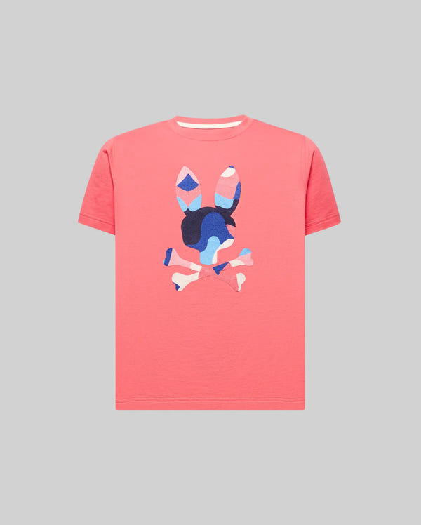 Kids Ara Graphic Tee in coral jersey knit, featuring a large, centered Psycho Bunny skull logo with a vibrant blue, light blue, pink, and white camouflage pattern.