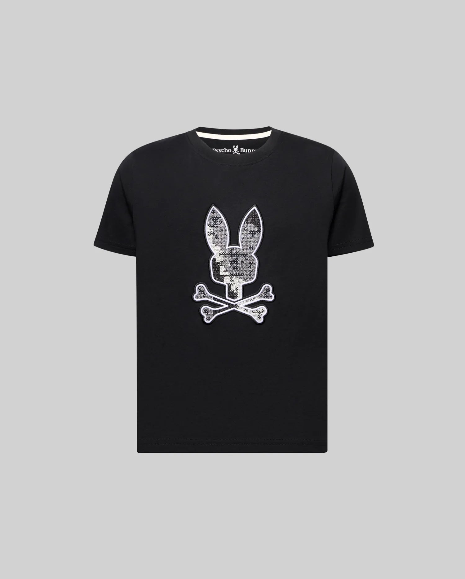 Kids Olivier Graphic Tee, black classic fit jersey knit with a large white and silver textured bunny skull and crossbones chest graphic and small Psycho Bunny text on the inner collar.