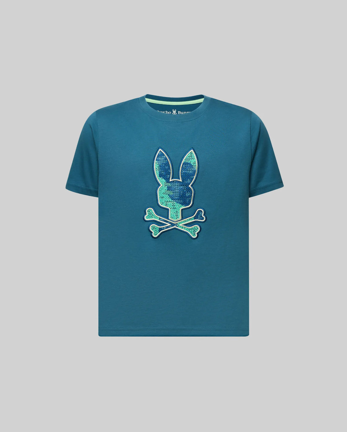 Kids Olivier Graphic Tee, a classic fit teal jersey t-shirt featuring a large central textured green and blue Psycho Bunny skull graphic.